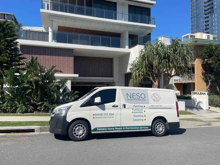 The professional team of Neso Handyman Services posing in front of the building in Brisbane, Queensland